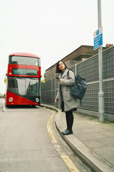 abel leaning against a bus